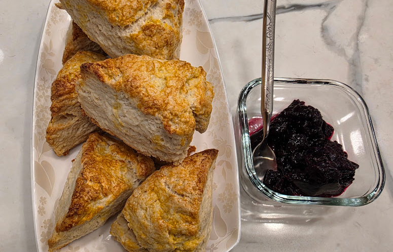 Freshly baked classic plain British scones with a golden-brown crust