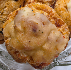 Savory smoked cheese scones with flaky layers served on a plate