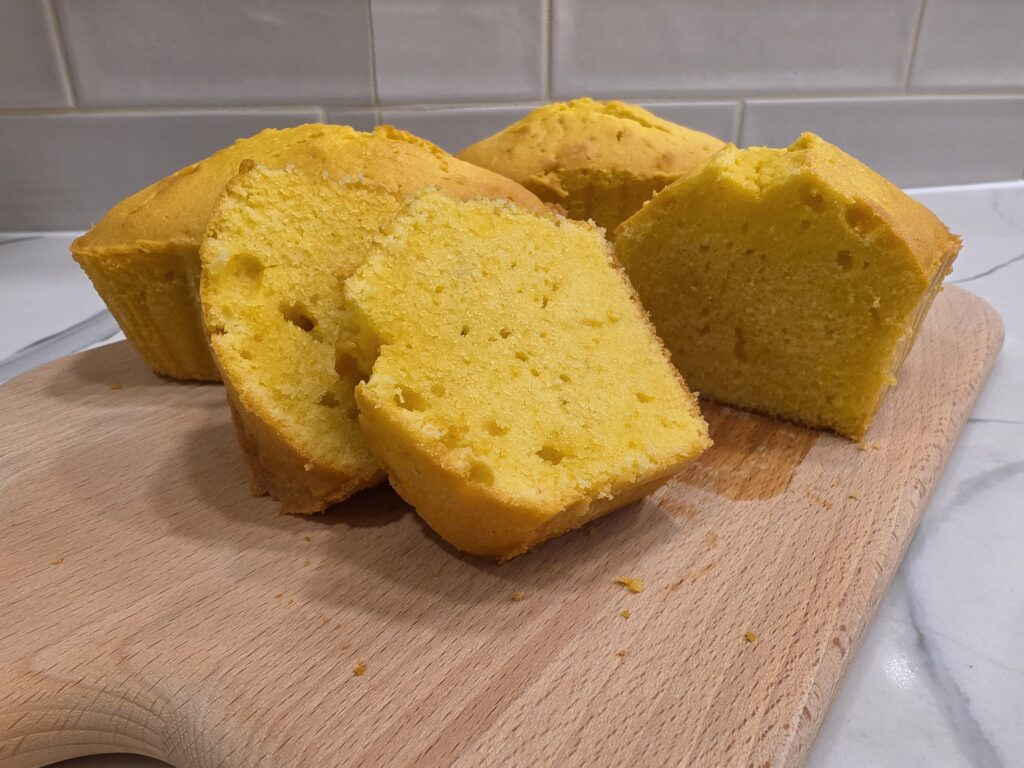 Close-up of a moist pound cake slice showing its dense, velvety crumb texture.