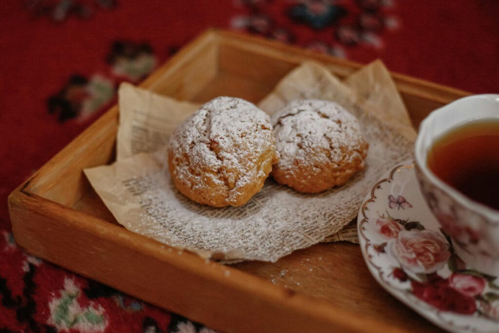 buttery round toasted pecan butter tea cookies coated in powdered sugar